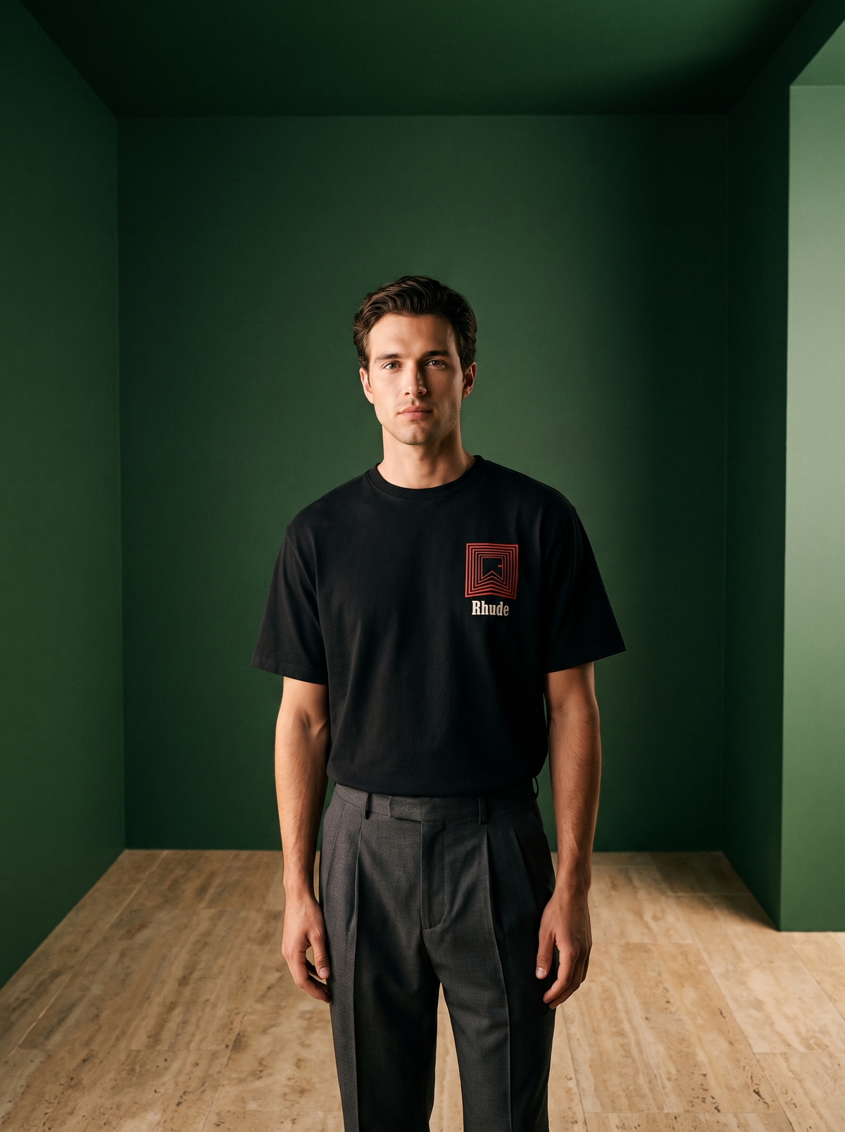 Model wearing a black Rhude graphic t-shirt